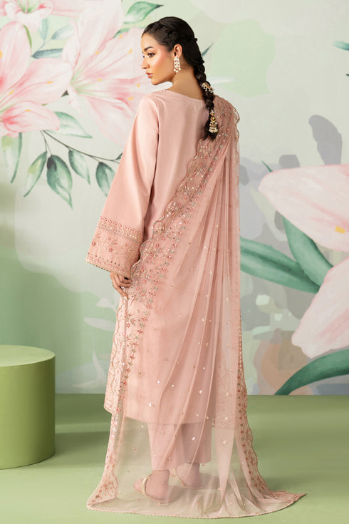Woman in a pink traditional outfit with floral background